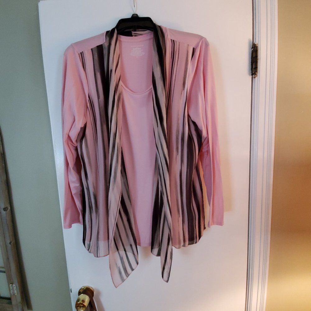 Pink blouse with scarf.